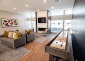 Thumbnail 18 of 23 - a living room with a couch and a table at Centennial Crossing, Waukee, 50263