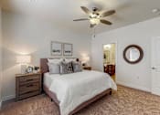 Thumbnail 3 of 23 - a bedroom with a bed and a ceiling fan at Centennial Crossing, Iowa, 50263