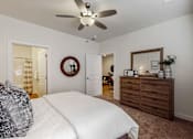 Thumbnail 5 of 23 - a bedroom with a bed and a ceiling fan at Centennial Crossing, Waukee