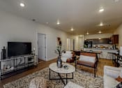 Thumbnail 6 of 23 - a living room with a couch and a television at Centennial Crossing, Waukee, IA