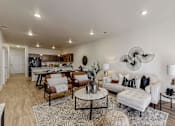 Thumbnail 1 of 23 - a living room with a couch and a table at Centennial Crossing, Waukee