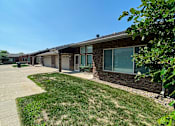 Thumbnail 5 of 16 - A sunny day at a residential area with houses and green lawns.at Cottages at Johnston Commons, Johnston  