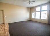 Thumbnail 10 of 16 - Empty room with a ceiling fan and three windows.at Cottages at Johnston Commons, Johnston, 50131  