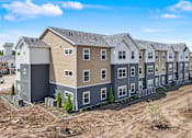 Thumbnail 39 of 53 - A row of new houses are being built in a residential area.