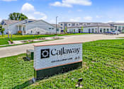 Thumbnail 51 of 53 - A sign for Callaway stands in front of a building.