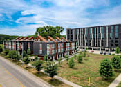 Thumbnail 33 of 42 - A large building with a parking lot in front of it. at Eagle View Lofts, Iowa