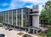 Thumbnail 25 of 42 - A modern building with a parking lot in front. at Eagle View Lofts, Iowa
