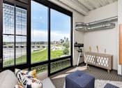 Thumbnail 42 of 42 - A room with a large window overlooking a cityscape. at Eagle View Lofts, Iowa, 50309