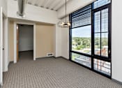 Thumbnail 7 of 42 - A room with a view of the outside through the window. at Eagle View Lofts, Des Moines, IA