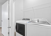 Thumbnail 35 of 52 - A white microwave and dishwasher in a kitchen.