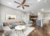 Thumbnail 14 of 32 - a living room with a couch and a ceiling fan at The Barclay Apartments, Altoona, 50009