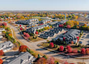 Thumbnail 49 of 50 - A suburban neighborhood with houses and trees in autumn colors. at Stonegate Crossing Apartments, Clive, IA, 50325