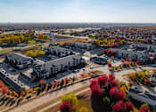 Thumbnail 48 of 50 - A view of a residential area with houses and trees. at Stonegate Crossing Apartments, IOWA, 50325