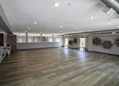 Thumbnail 28 of 34 - A spacious room with wooden flooring and a white ceiling.at Linc, Des Moines, IA  