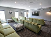Thumbnail 23 of 34 - A room with a grey wall and a television on it.at Linc, Iowa   