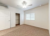 Thumbnail 19 of 35 - A room with a carpeted floor at Melbourne Apartments, Georgia