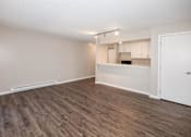 Thumbnail 17 of 90 - A room with a kitchenette and a door. at Rosemont Place Apartments, Des Moines