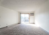 Thumbnail 41 of 90 - A room with a carpeted floor and a sliding glass door. at Rosemont Place Apartments, Iowa, 50320