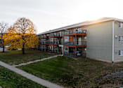 Thumbnail 84 of 90 - Apartment building with a tree in front of it. at Rosemont Place Apartments, Des Moines, IA, 50320