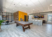Thumbnail 25 of 30 - a game room with a pool table and a bar at Soll, Des Moines Iowa   