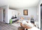 Thumbnail 1 of 30 - a living room with a couch and a table at Soll, Des Moines  
