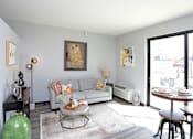 Thumbnail 2 of 30 - a living room with a couch and a table at Soll, Iowa   