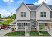 Thumbnail 27 of 30 - an exterior view of a house with a yard and a sidewalk at Soll, Des Moines  