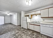 Thumbnail 20 of 21 - A kitchen with white appliances and a tiled floor. at Somerset Apartments, Des Moines, IA