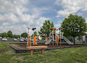 Thumbnail 21 of 21 - a playground in a park on a cloudy day at Somerset Apartments, Des Moines, 50315