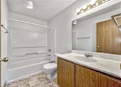 Thumbnail 18 of 21 - a bathroom with a sink toilet and a bath tub at Somerset Apartments, Des Moines, IA