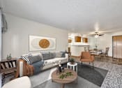 Thumbnail 5 of 21 - the living room of an apartment with a couch and a table at Somerset Apartments, Des Moines, Iowa