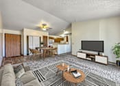 Thumbnail 2 of 21 - a living room with a couch and a table and a tv at Somerset Apartments, Iowa