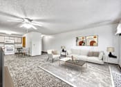 Thumbnail 4 of 21 - a living room with a couch and a table at Somerset Apartments, Iowa, 50315
