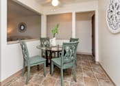 Thumbnail 6 of 26 - A dining room with a table and chairs at Sutton Hill Apartments, Des Moines, IA
