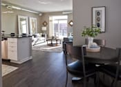 Thumbnail 3 of 40 - a living room and dining room with a table and chairs at Velocity Apartments, Iowa