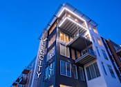 Thumbnail 35 of 40 - a building with a sign on the side of it at Velocity Apartments, Iowa, 50309