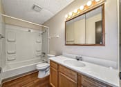 Thumbnail 8 of 20 - a bathroom with a sink toilet and a mirror at Foxwood Apartments, Indianola, 50125  