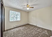 Thumbnail 10 of 20 - Carpeted Bedroom at Foxwood Apartments, Indianola, IA, 50125