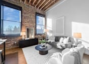 Thumbnail 30 of 99 - A living room with a brick wall and a fireplace.at Plant 1 Lofts, N. Newton, IA 50208  