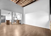 Thumbnail 64 of 99 - A large empty room with wooden floors and white walls.at Plant 1 Lofts, N. Newton, 50208  