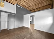 Thumbnail 65 of 99 - A room with wooden floors and white walls.at Plant 1 Lofts, N. Newton Iowa   