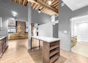 Thumbnail 71 of 99 - A kitchen with a large island in the middle of the room.at Plant 1 Lofts, N. Newton, IA  