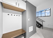 Thumbnail 79 of 99 - A small room with a bench and a window.at Plant 1 Lofts, Iowa, 50208