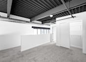 Thumbnail 91 of 99 - A large, empty room with a carpeted floor and white walls.at Plant 1 Lofts, N. Newton  