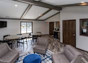 Thumbnail 52 of 57 - a living room with couches chairs and tables and a tv  at Bristol Ridge, Urbandale, IA