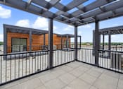 Thumbnail 51 of 77 - Rooftop terrace with pergola and railing at The Flats at West Glen Apartments, Iowa, 50266