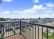 Thumbnail 59 of 77 - Private balcony overlooking residential community at The Flats at West Glen Apartments, West Des Moines, IA