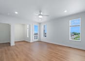 Thumbnail 64 of 77 - Spacious living room with ceiling fan and balcony access at The Flats at West Glen Apartments, West Des Moines, 50266