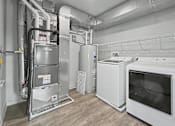Thumbnail 14 of 53 - A clean, empty room with a white oven, dryer, and a refrigerator.