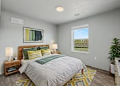 Thumbnail 12 of 53 - A bedroom with a bed, nightstands, and a window.